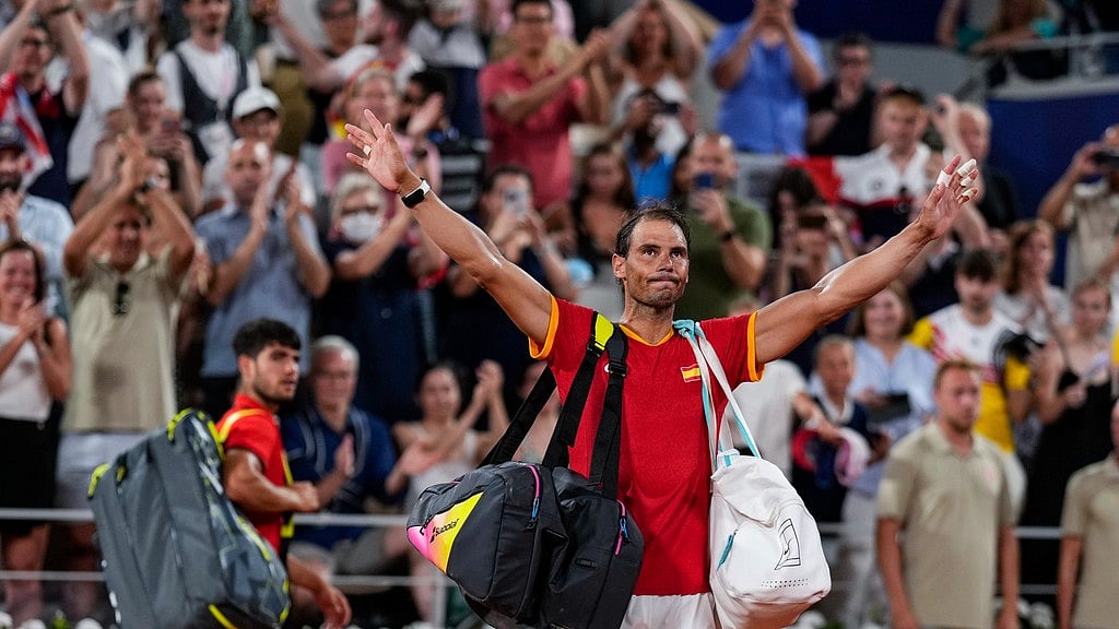 Carlos Alcaraz, left, and Rafael Nadal of Spain leave the court after losing against Austin Krajicek and Rajeev Ram of the USA during the men's doubles quarter-final tennis competition at the Roland Garros stadium, at the 2024 Summer Olympics, Wednesday, July 31, 2024, in Paris, France. - AP/Manu Fernandez