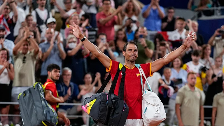 Carlos Alcaraz, left, and Rafael Nadal of Spain leave the court after losing against Austin Krajicek and Rajeev Ram of the USA during the men's doubles quarter-final tennis competition at the Roland Garros stadium, at the 2024 Summer Olympics, Wednesday, July 31, 2024, in Paris, France. - AP/Manu Fernandez