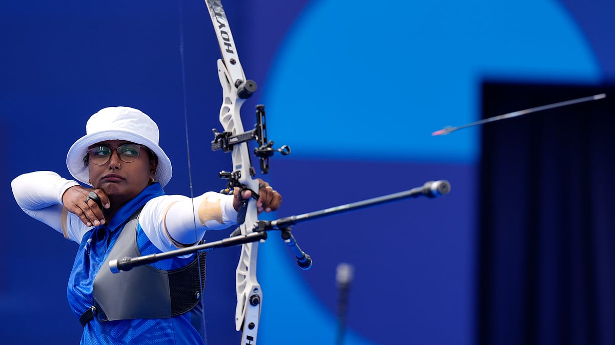 AP Photo/Brynn Anderson : India's Deepika Kumari shoots during the Archery individual elimination round against Estonia at the 2024 Summer Olympics.