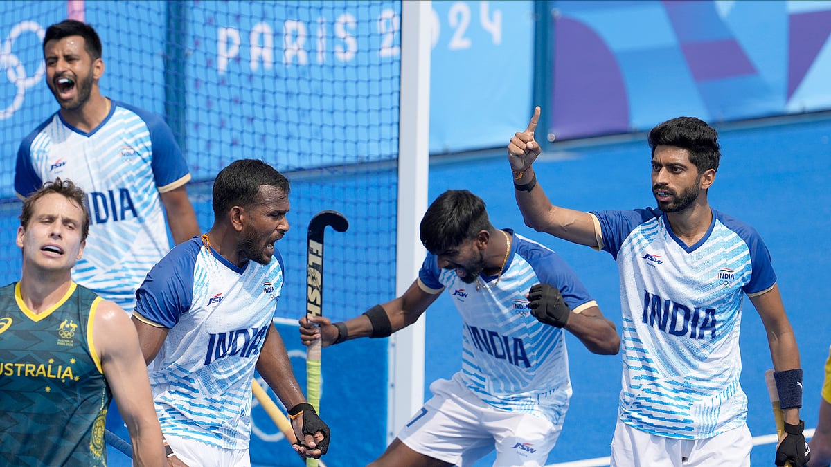 Shamsher Singh left, and his teammates jubilate at the end of the match. AP Photo