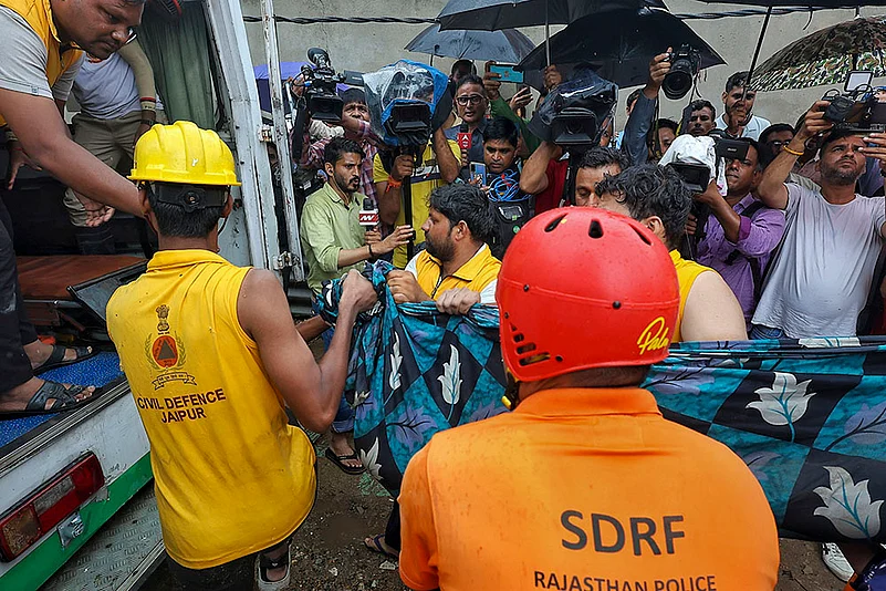 SDRF and civil defence personnel during rescue operation after House basement flooding in Jaipur