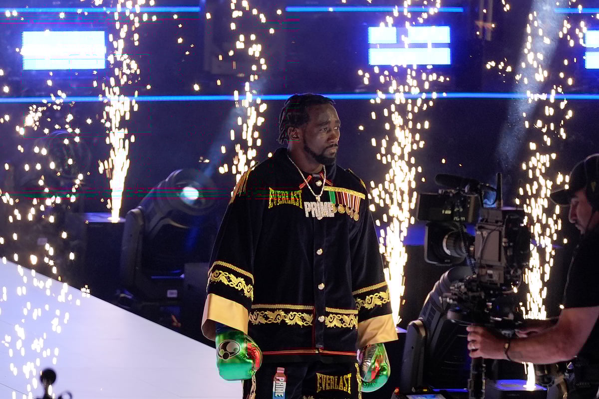 (AP Photo/Damian Dovarganes) : Terence Crawford walks to the ring before a super welterweight championship boxing match against Israil Madrimov in Los Angeles, Saturday, Aug. 3, 2024. 