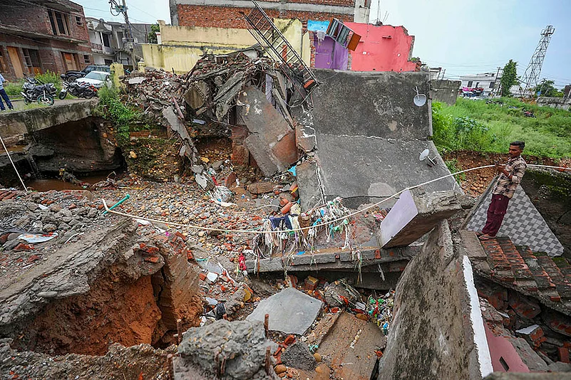 Debris of houses after Flash floods damage houses in Jammu