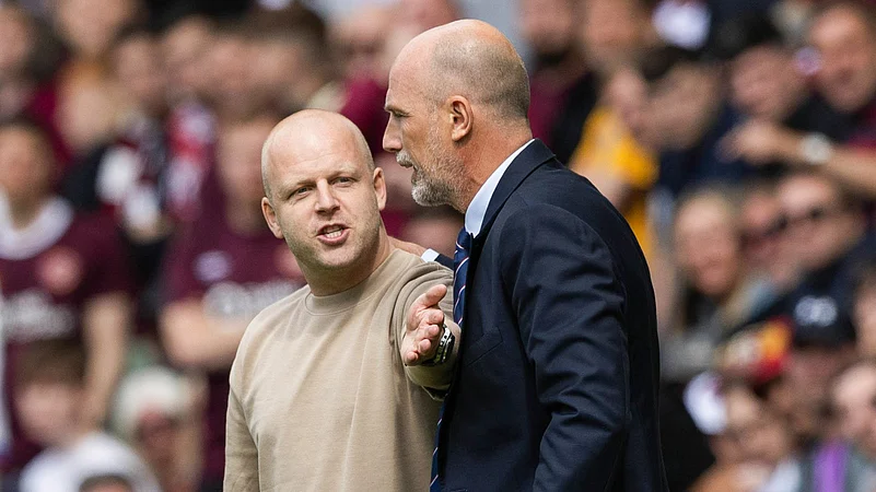 Steven Naismith and Philippe Clement have a heated discussion during the game