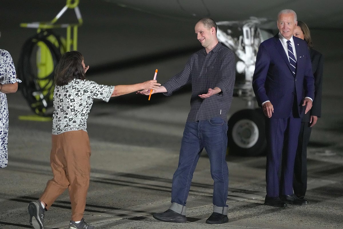 Evan Gershkovich, Joe Biden and Kamala Harris 