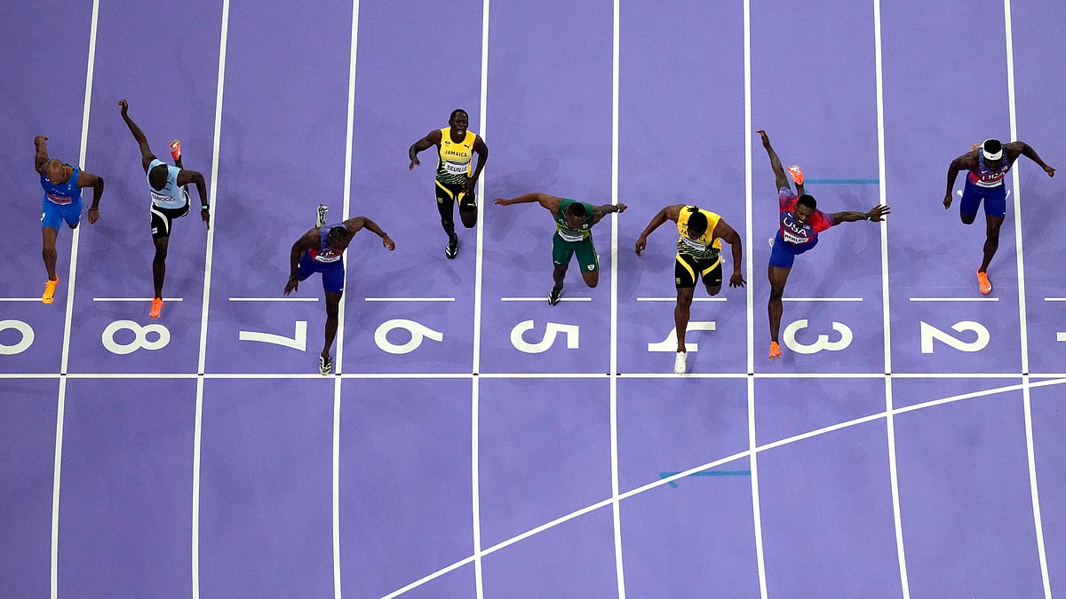 Noah Lyles, of the United States, in lane seven, wins the men's 100-meter final at the 2024 Summer Olympics, Sunday, Aug. 4, 2024, in Saint-Denis, France. - AP Photo/David J. Phillip