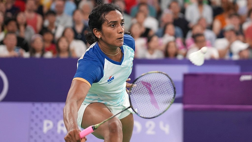 AP/Kin Cheung : India's PV Sindhu plays against China's He Bingjiao during their women's singles badminton round of 16 match.