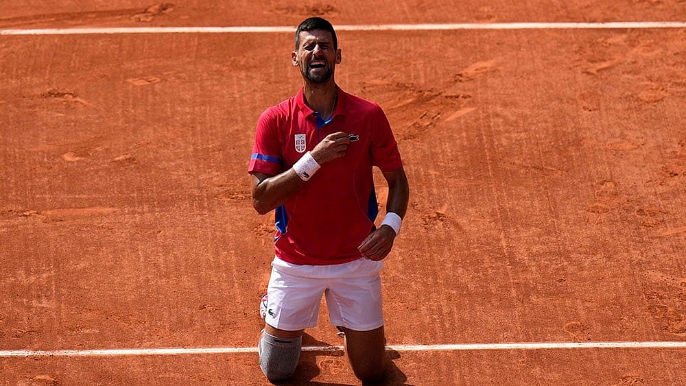 | Photo: AP/Andy Wong : Serbia's Novak Djokovic reacts after winning Paris Olympics Tennis gold