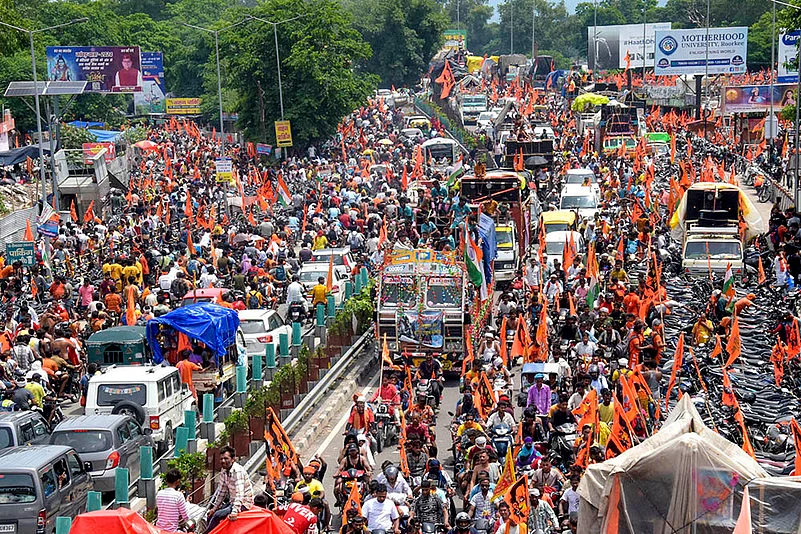 Kanwariyas return after taking Ganga river water in Haridwar.