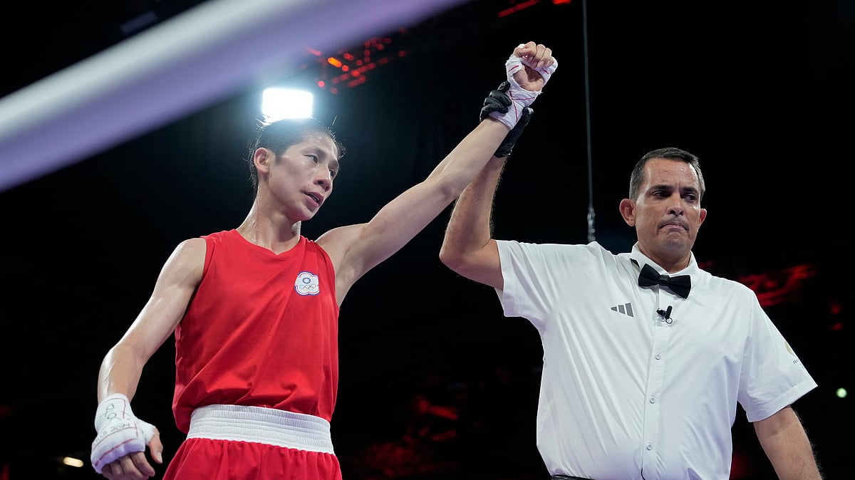 (AP Photo/Ariana Cubillos) : Taiwan's Lin Yu-ting reacts after defeating Uzbekistan's Sitora Turdibekova in their women's 57 kg preliminary boxing match at the 2024 Summer Olympics, Friday, Aug. 2, 2024, in Paris, France.