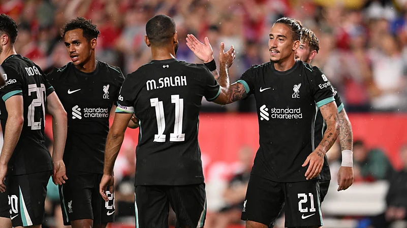 Kostas Tsimikas scored Liverpools third goal against Manchester United