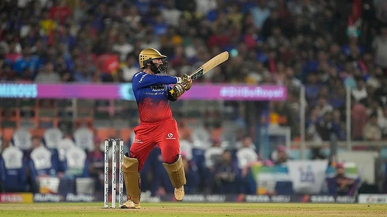 Dinesh Karthik plays a shot - | Photo: AP/Ajit Solanki