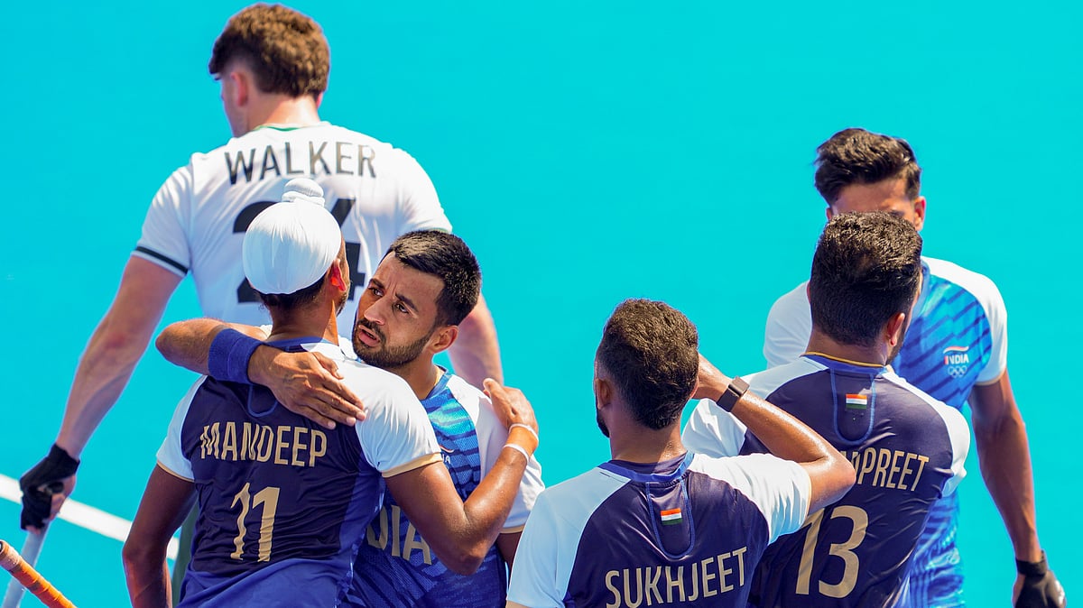 Harmanpreet Singh celebrates with teammates after scoring a goal. PTI Photo