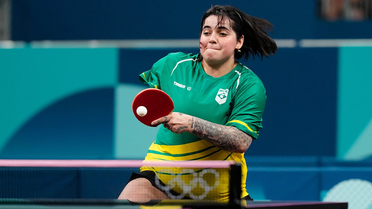 AP Photo/Petros Giannakouris : Brazil's Bruna Alexandre, with her teammate Giulia Takahashi, plays against South Korea's Shin Yubin and Jeon Jihee during a women's teams round of 16 table tennis match at the 2024 Summer Olympics, Monday, Aug. 5, 2024, in Paris, France.