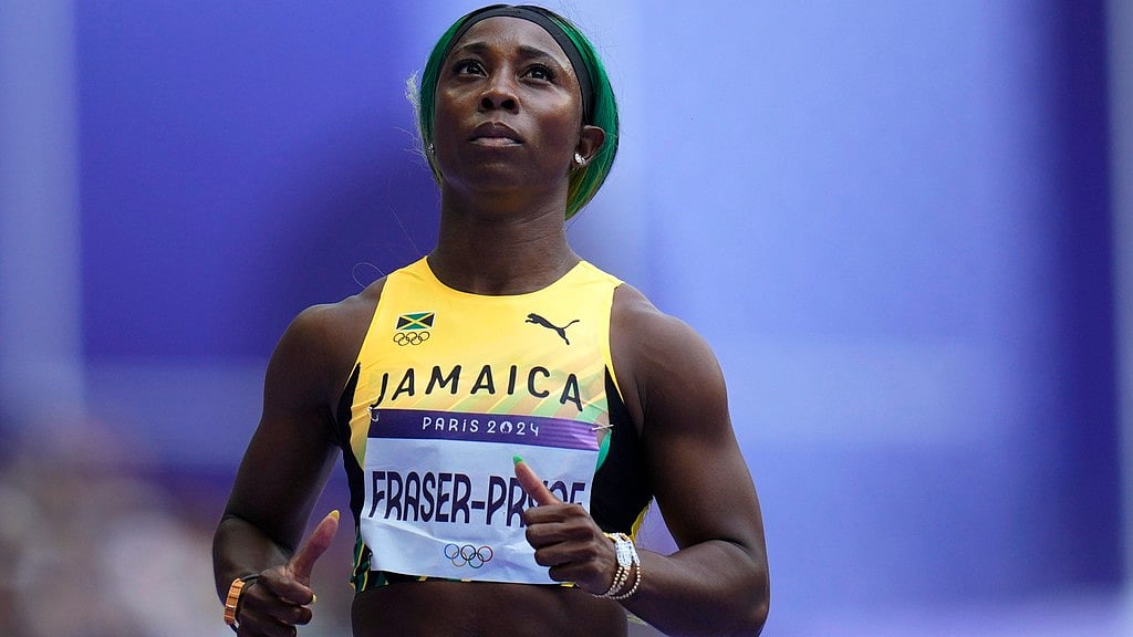 AP/Petr David Josek : Shelly-Ann Fraser-Pryce, of Jamaica.