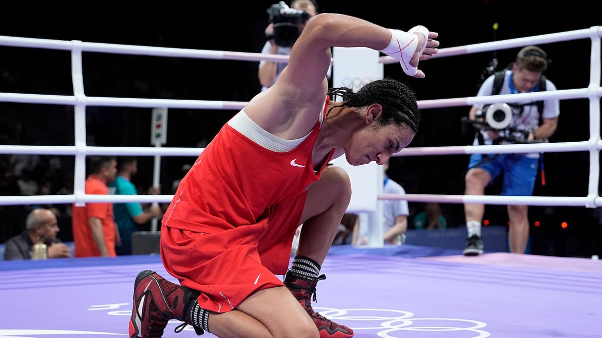 AP Photo/John Locher : Algeria's Imane Khelif, celebrates after defeating Hungary's Anna Hamori in their women's 66kg quarterfinal boxing match at the 2024 Summer Olympics.
