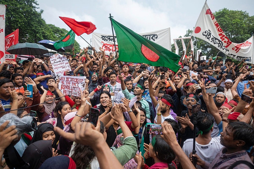 Activists take part in a protest march against Prime Minister Sheikh Hasina
