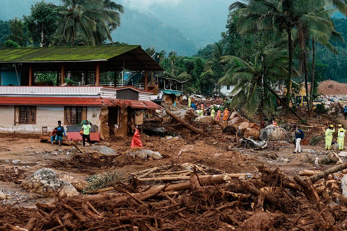 Rescuers on their second day of mission following Tuesday’s landslides work next to a damaged house at Chooralmala, Wayanad district, Kerala. - AP