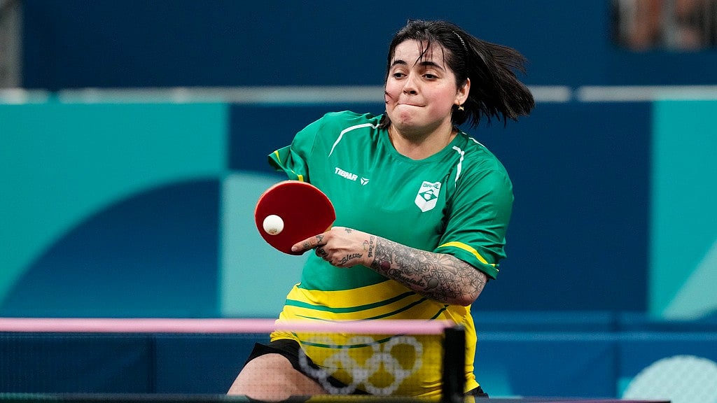 AP/Petros Giannakouris : Brazil's Bruna Alexandre competes in the women's teams round of 16 table tennis event at the Paris Olympics on Monday (August 5).