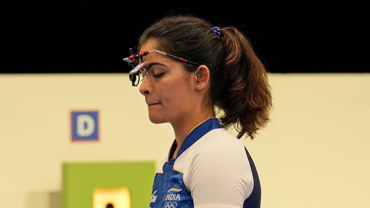 Manu Bhaker prepares to compete in the 10m air pistol. AP Photo