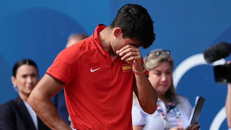 Carlos Alcaraz cut an emotional figure after his defeat in the Olympic Games final on Sunday - null