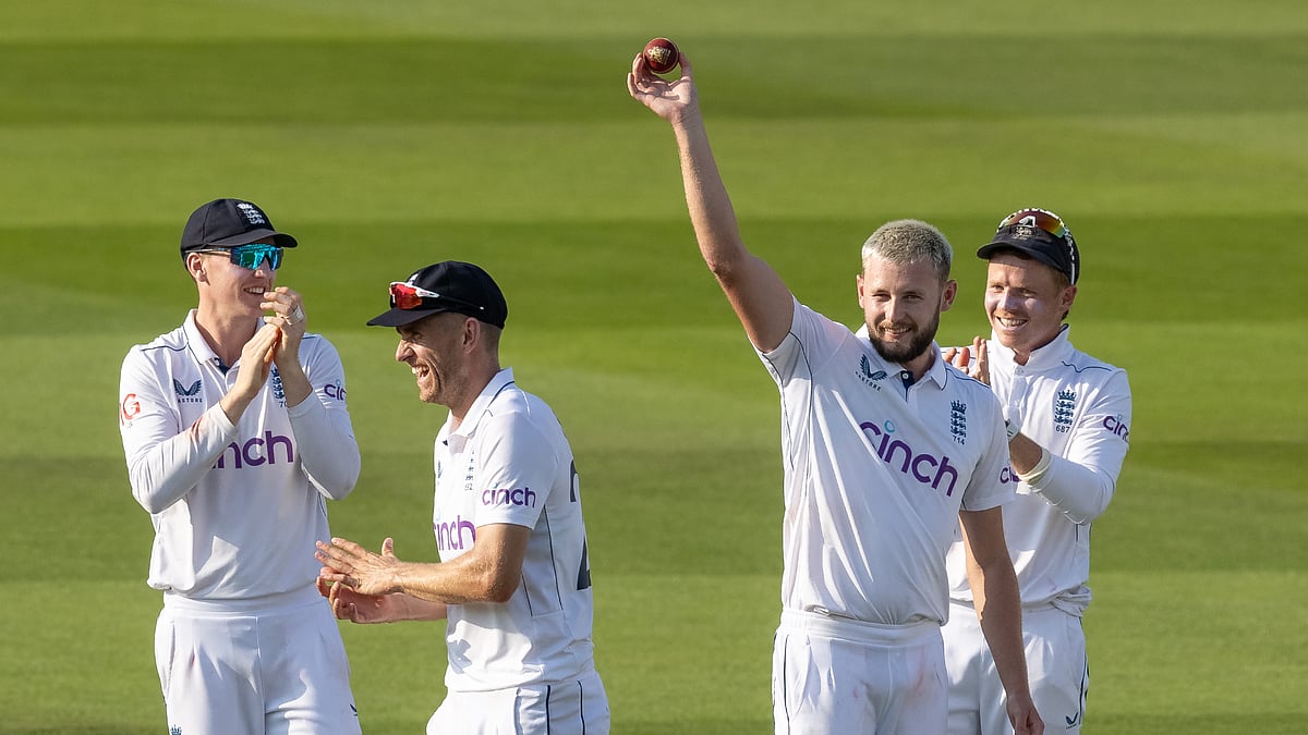 Gus Atkinson celebrates with the ball after another five-wicket haul at Lord's.
