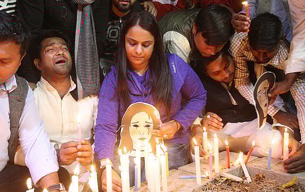 Via Getty Images
 : Students do a candle light march demanding justice for victim of Unnao rape case in New Delhi. 