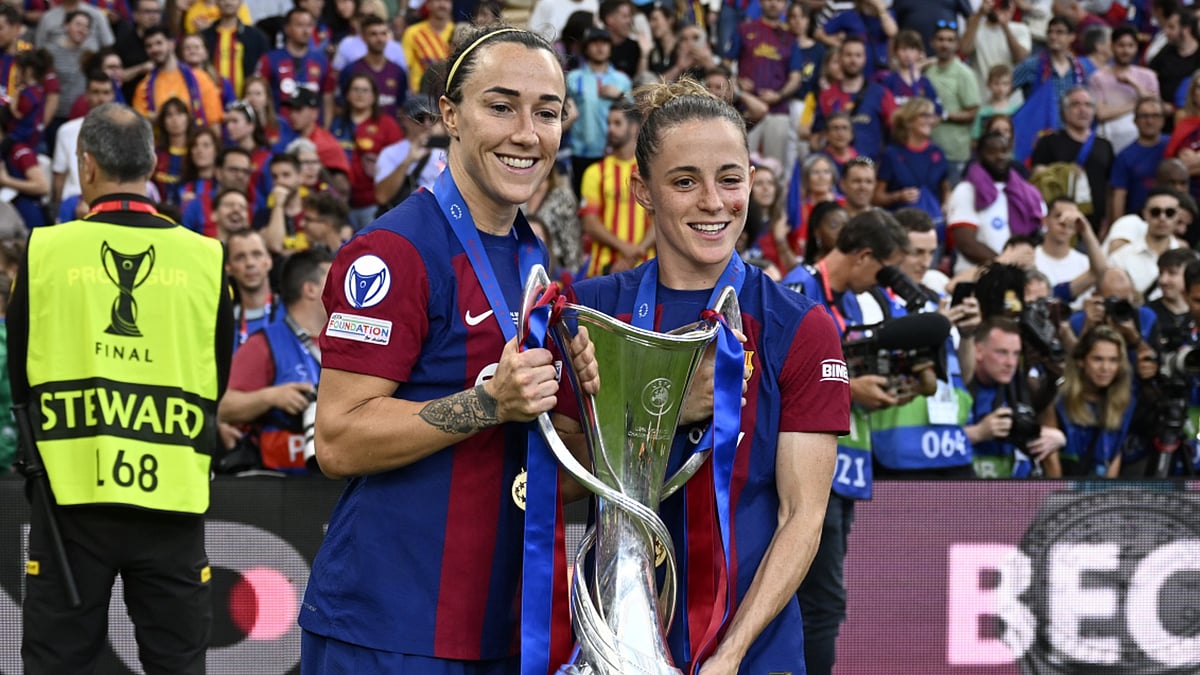 Lucy Bronze celebrates with the Champions League trophy