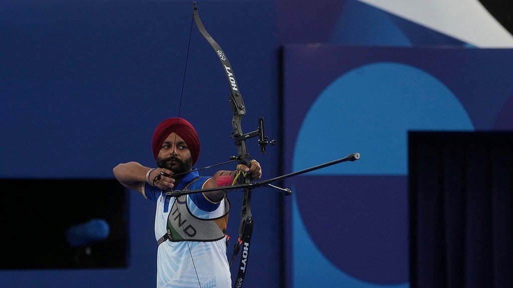 Photo: AP : India's gold-winning para archer Harvinder Singh in action at Paris Paralympic Games 2024.