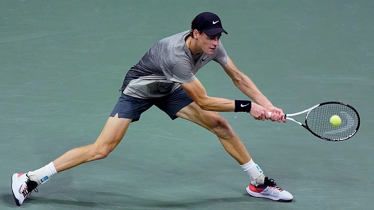 Jannik Sinner returns to Daniil Medvedev during their US Open 2024 men's singles quarter-finals match in New York. - AP/Eduardo Munoz Alvarez