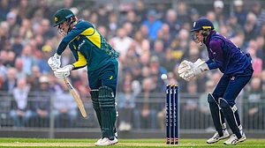 Malcolm Mackenzie/PA via AP : Jake Fraser-McGurk of Australia bats during the second T20 International match between Scotland and Australia at The Grange Club, Edinburgh, Scotland.