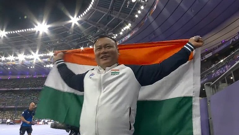 X : Hokata Hotozhe Sema celebrates after winning bronze.