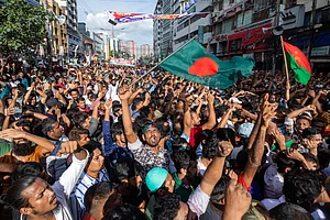 via AP : People gather in front of the Bangladesh Nationalist Party (BNP) headquarters during a rally in Dhaka