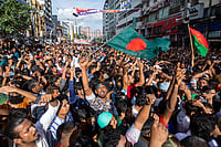 via AP : People gather in front of the Bangladesh Nationalist Party (BNP) headquarters during a rally in Dhaka