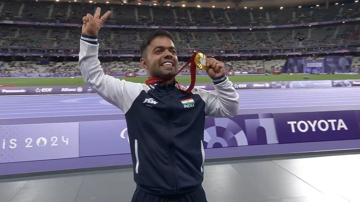 X : India's Navdeep Singh celebrates his gold medal triumph.