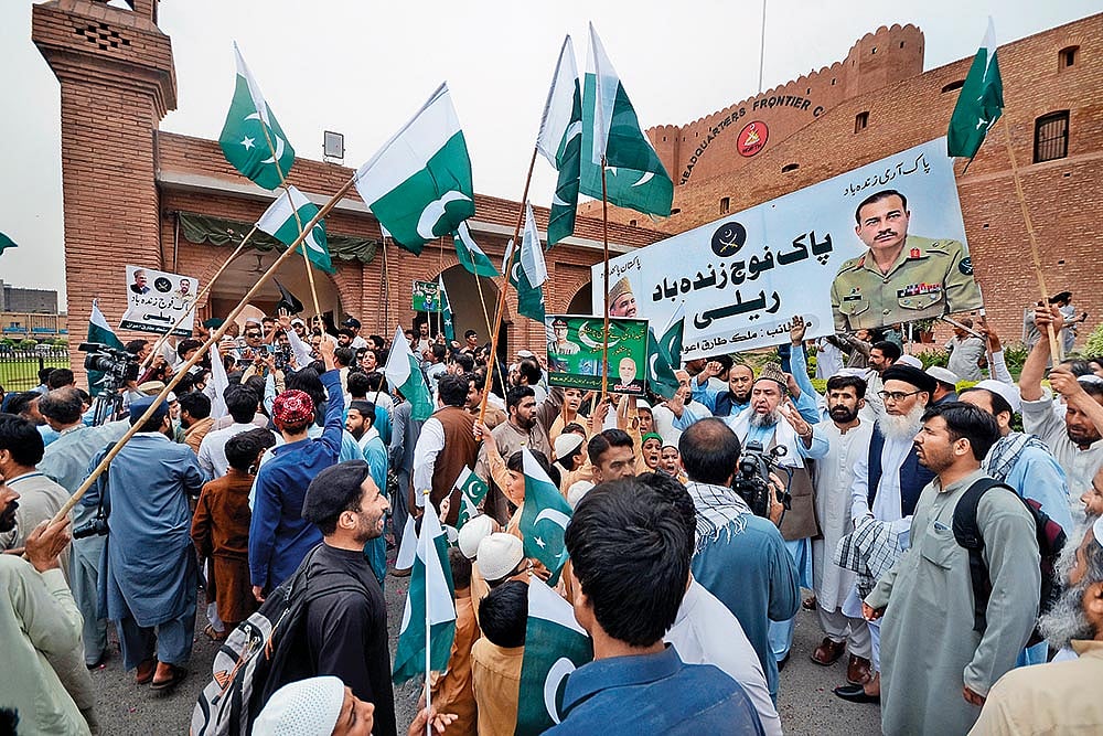 Photo: Getty Images : Show of Support: People at a rally in solidarity with Pakistan’s army in Peshawar in May 2023 after military installations were allegedly damaged by supporters of former Prime Minister Imran Khan following his arrest
