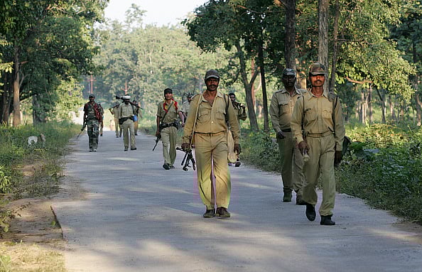 Getty Images : police officers patrolling the naxal infested forests at Bijapur near Dantewada