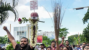 PTI : Junior doctors holding broom shout slogans as they march towards Swasthya Bhawan.