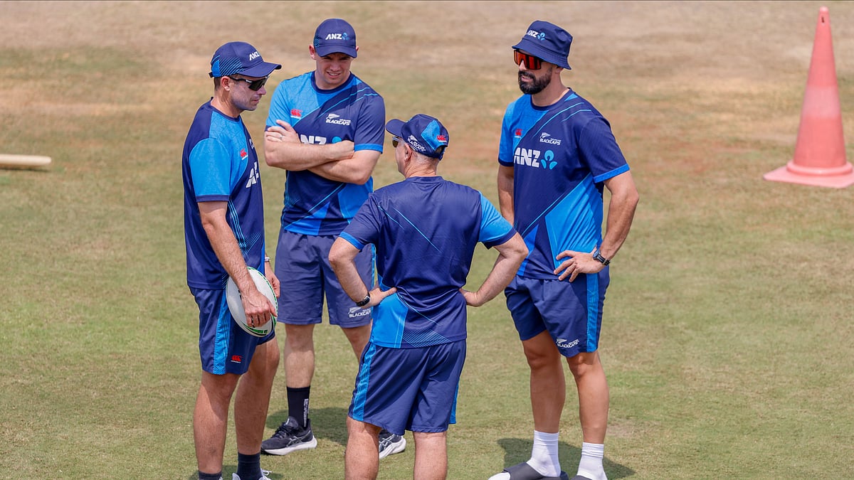 New Zealand's captain, Tim Southee, left, interacts with teammates during a practice session before the start of the second day of the only test match. - AP Photo