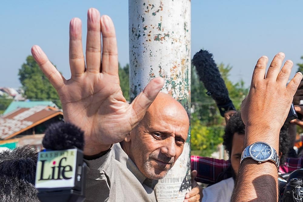 Photo: PTI/S Irfan : J-K polls: Engineer Rashid reaches Srinagar