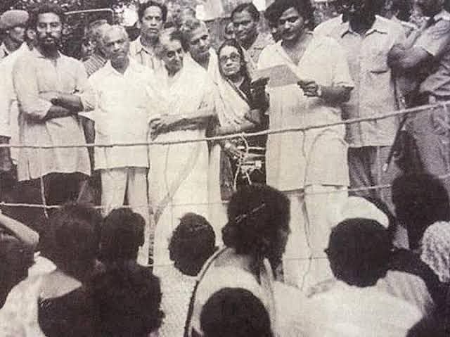 JNU student leader Sitaram Yechury reading a memorandum against Indira Gandhi, as she watches.