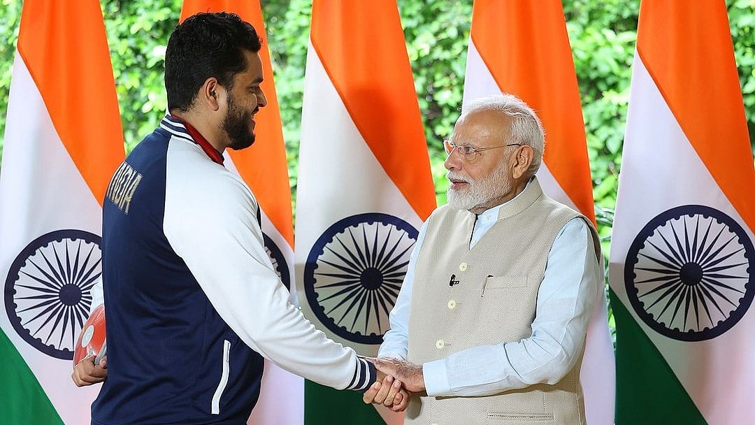 Instagram/ @yogeshkathuniya : Yogesh Kathuniya with Prime Minister Narendra Modi.