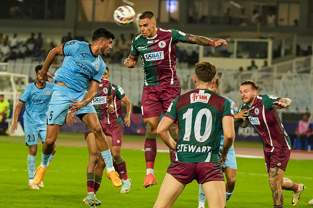 | Photo: IPL/Swapan Mahapatra : ISL 2024-25: MCFC and MBSG Players vie for the ball during an ISL match