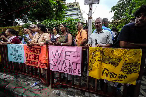 Kolkata rape-murder case: Sympathisers stand by the posters of an ongoing protest rally in Kolkata