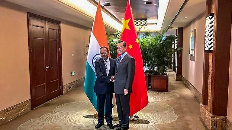 NSA Ajit Doval (L) with Chinese Foreign Minister Wang Yi - PTI