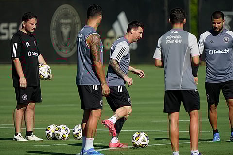 Major League Soccer: Inter Miami forward Lionel Messi, center, works out with teammates