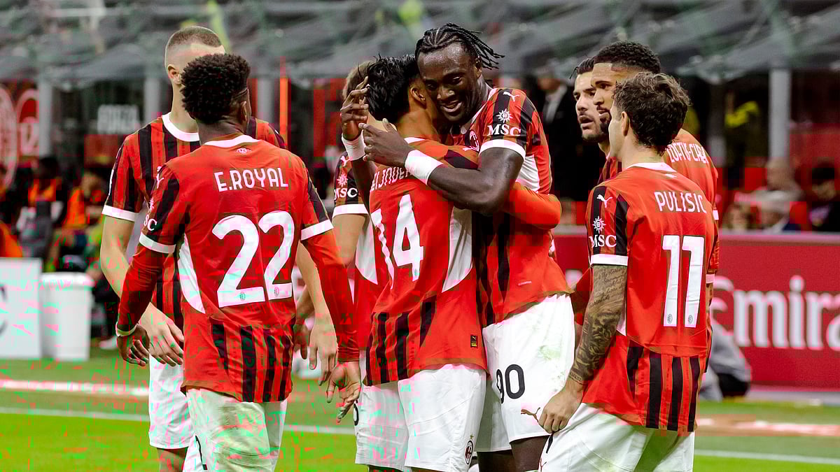 Milan celebrate their fourth goal against Venezia