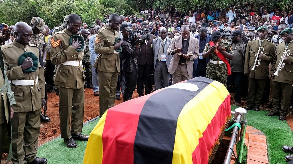 AP : Members of the Uganda People's Defense Force pay their respects at the funeral of Ugandan Olympic athlete Rebecca Cheptegei as her casket is lowered into the grave in Kapkoros, Bukwo District, Uganda, on Saturday, Sept. 14. 2024.