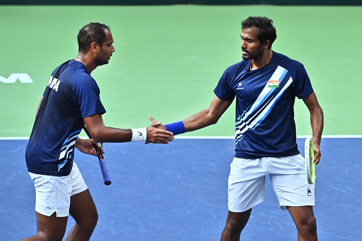 India's Sriram Balaji, right, and Ramkumar Ramanathan between points during the men's doubles match against Sweden's Filip Bergevi and Andre Goransson in the Davis Cup between Sweden and India in the Royal Tennis Hall, Stockholm, Sunday Sept. 15, 2024. 
 - (Claudio Bresciani/TT via AP)