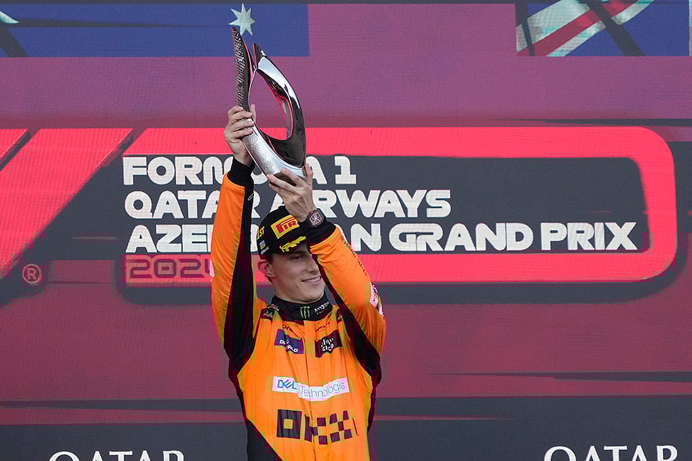 | Photo: AP/Sergei Grits : Azerbaijan GP 2024: McLaren driver Oscar Piastri of Australia celebrates after he won the race